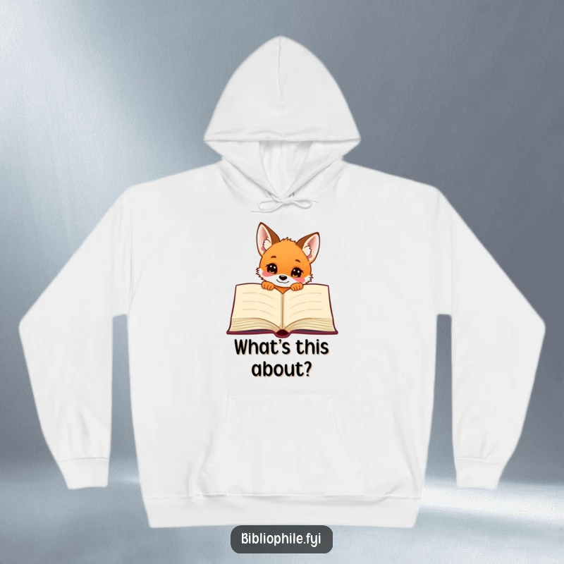 Funny and curious fox puppy peeking from behind a giant book, featured on a warm, comfortable hoodie.