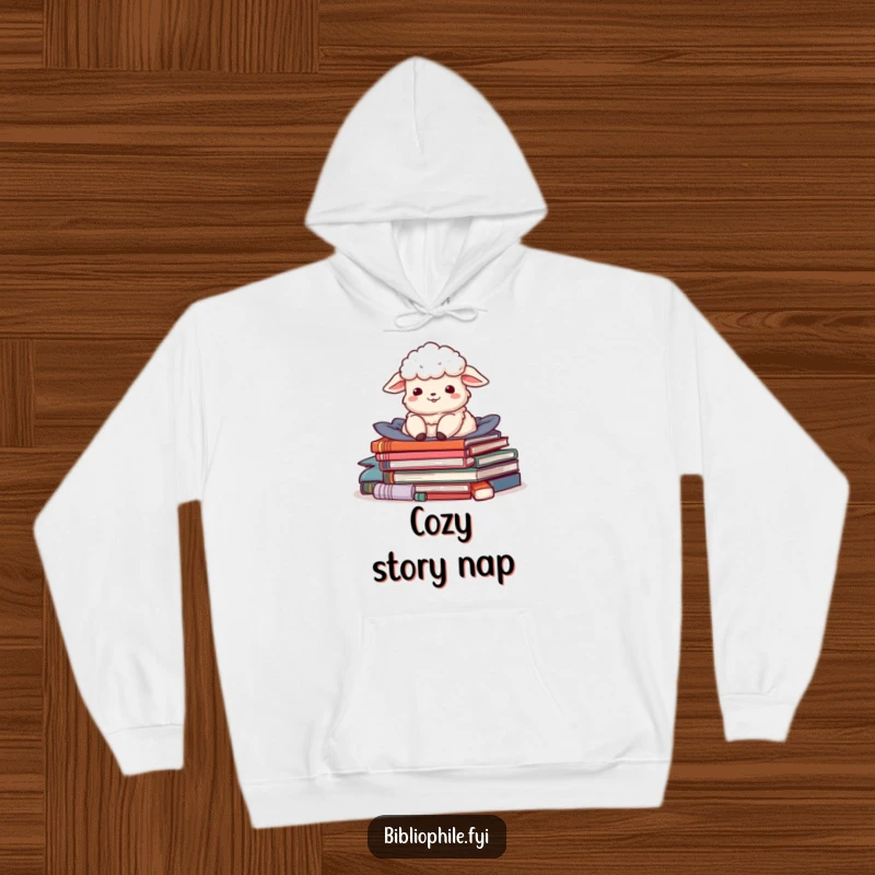 Funny hoodie featuring a delighted sheep character nestled in a pile of stories, offering extreme coziness and literary charm.