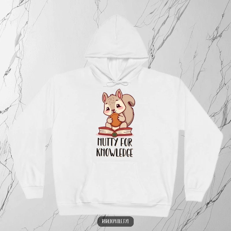 Funny hoodie showcasing a cute squirrel character hoarding a nut inside a thick book, perfect for cozy reading sessions.