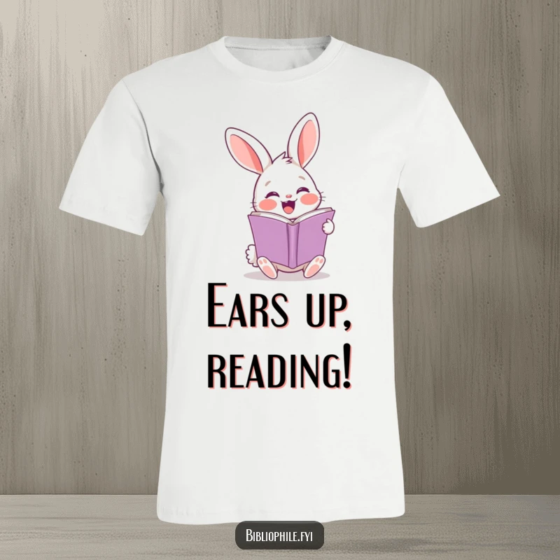 Funny rabbit t-shirt featuring a cheerful character excitedly turning a book page, enthusiastic reading.