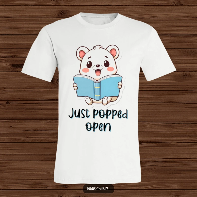 Funny t-shirt showing a cute animal with a surprised expression holding a book that has just popped open, emphasizing reading shock.